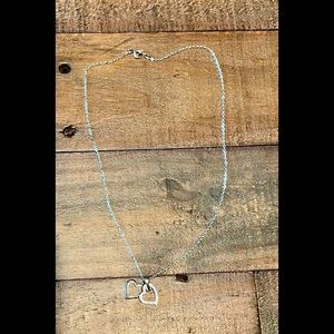 Silver Diamond encrusted heart necklace.